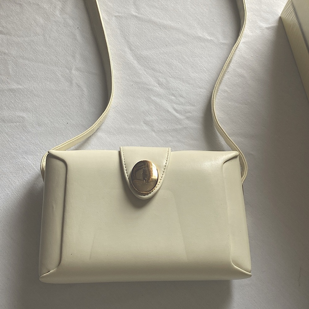 Cream colored shoulder bag. Soft material.